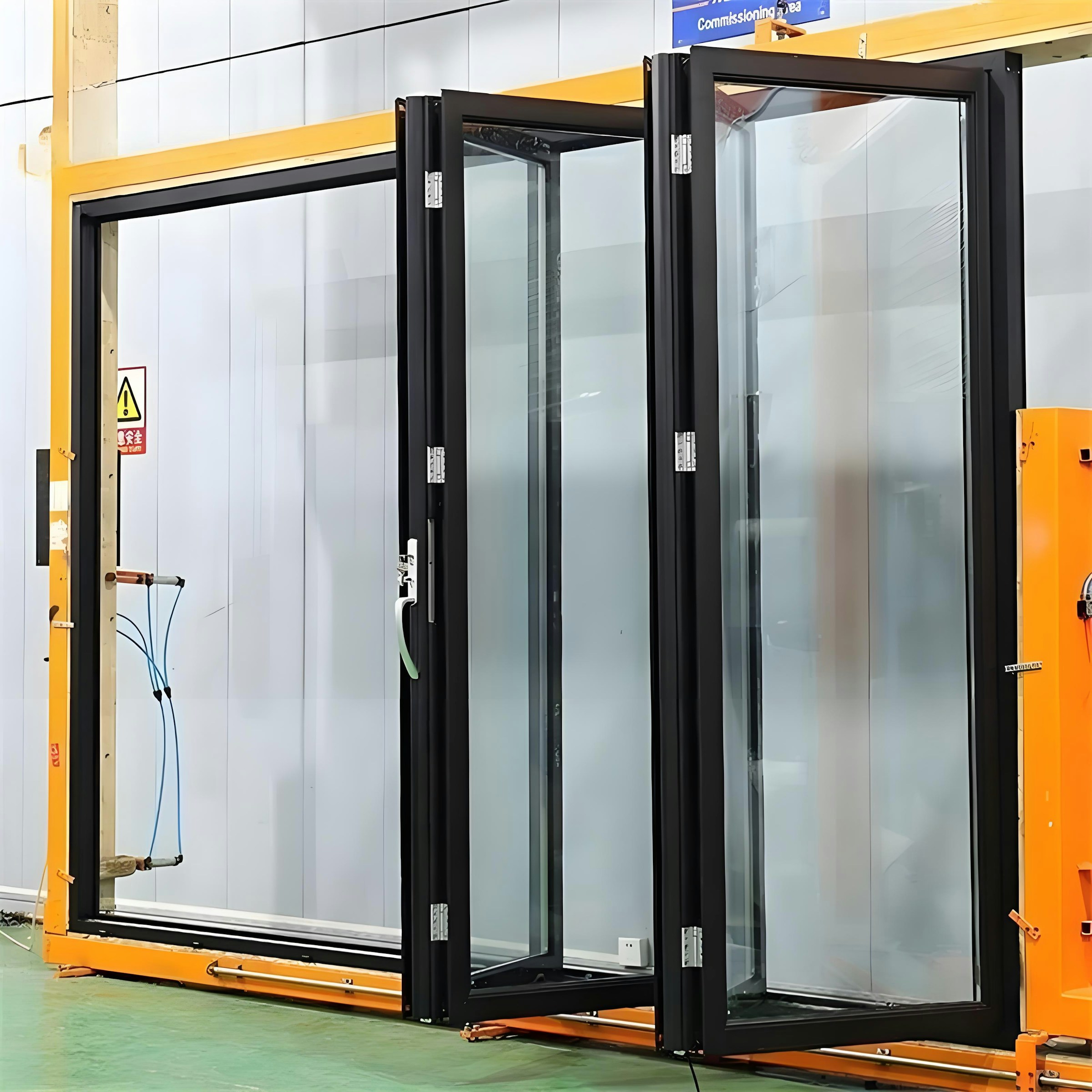Black aluminium folding door system prepared for factory-direct supply